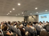 Full room during the discussion panel on AI