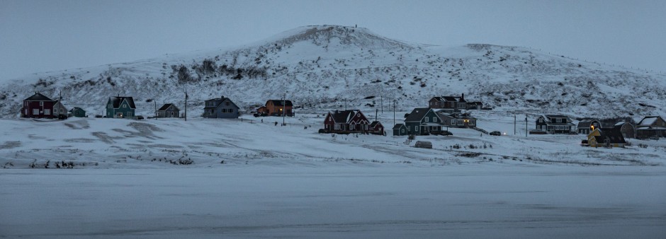 Colorful houses of the Îles de la Madeleine at dusk in winter